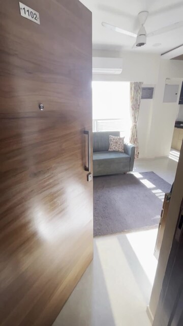 Living Room in 1 BHK Apartment at Romell Amore, Andheri West – for Sale