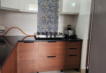Kitchen in 2.5 BHK Apartment at Amrapali Princely Estate, Sector 76 – for Sale