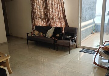 Living Room in 2 BHK Apartment at The Chatterjee The Crown Greens, Hinjewadi – for Rent