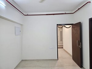 Bedroom in 2 BHK Apartment at Omkar Signet, Malad East – for Rent