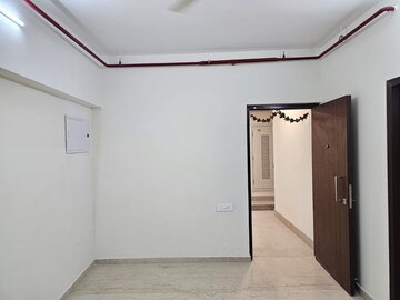 Bedroom in 2 BHK Apartment at Omkar Signet, Malad East – for Rent
