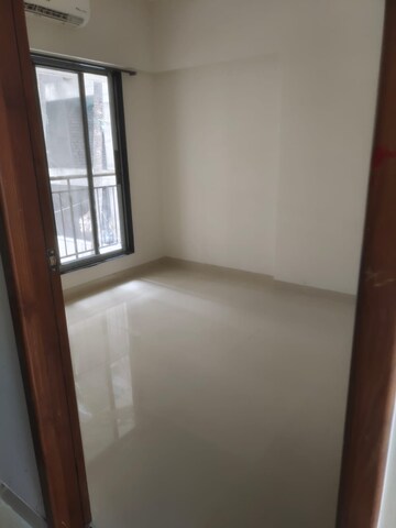 Room in 1 BHK Apartment at Ruparel Elara, Kandivali West – for Rent