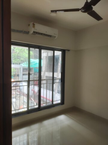 Room in 1 BHK Apartment at Ruparel Elara, Kandivali West – for Rent