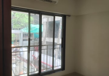 Bedroom in 2 BHK Apartment at Ruparel Elara, Kandivali West – for Rent