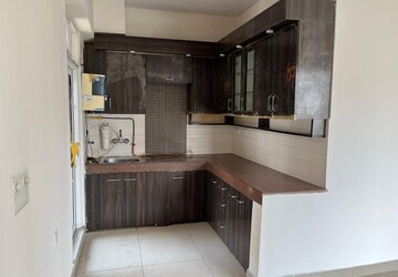 Kitchen in 2 BHK Apartment at Exotica Dreamville, Sector 16c Greater Noida – for Rent