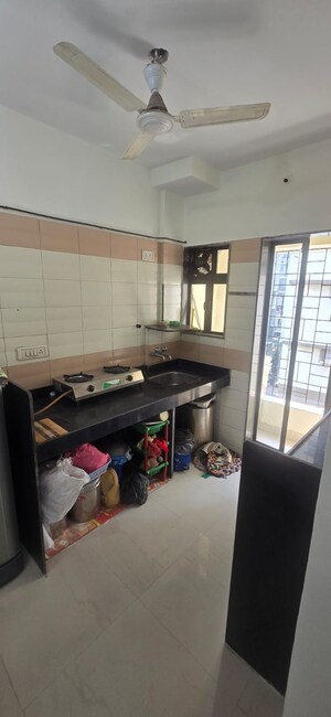 Kitchen in 1 BHK Apartment at Sonam Ganga CHS, Mira Road – for Sale