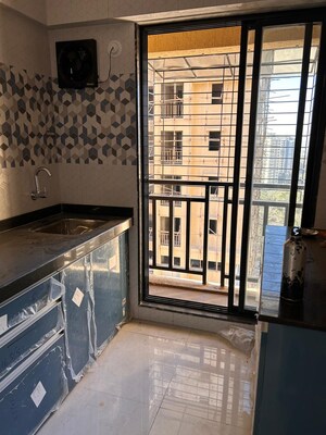 Kitchen in 1 BHK Apartment at Puranik Rumah Bali, Ghodbunder Road – for Sale