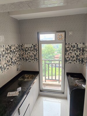 Kitchen in 1 BHK Apartment at Cosmos County II, Ghodbunder Road – for Sale