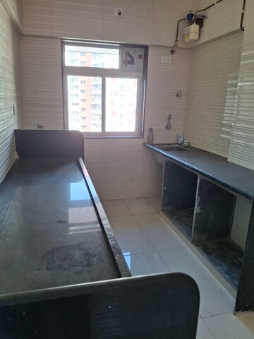 Kitchen in 1 BHK Apartment at Sai Dham CHSL, Dahisar East – for Sale