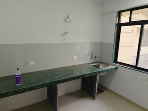 Kitchen in 1 BHK Apartment at Tulips CHS, Kavesar – for Sale