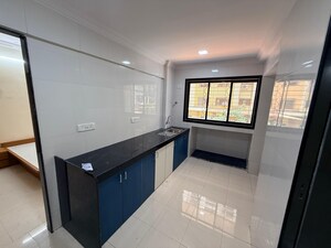 Kitchen in 1 BHK Apartment at Soham Parijat Gardens, Ghodbunder Road – for Sale