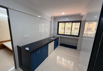 Kitchen in 1 BHK Apartment at Soham Parijat Gardens, Ghodbunder Road – for Sale