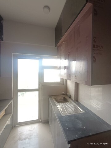 Kitchen in 3 BHK Apartment at Mahagun Mantra II Villaments, Sector 10 Greater Noida – for Rent