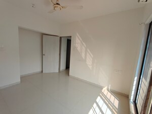 Room in 2.5 BHK Apartment at Tulips CHS, Kavesar – for Sale