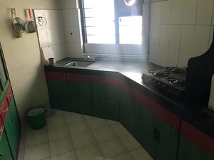 Kitchen in 2 BHK Apartment at Madhavbaug Society, Bhusari Colony – for Rent