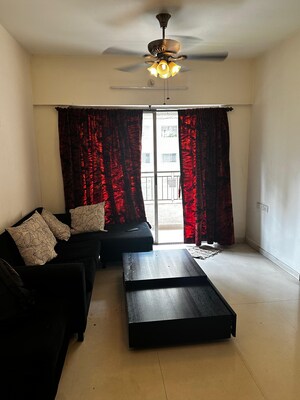 Living Room in 1 BHK Apartment at Lodha Palava City, Dombivli East – for Rent