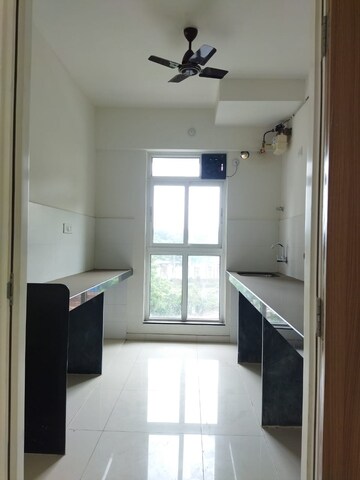Kitchen in 1 BHK Apartment at Raunak Unnathi Greens, Kasarvadavali – for Sale