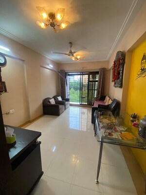 Living Room in 1 BHK Apartment at Ahuja Sea Crown, Kandivali West – for Rent