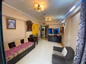 Living Room in 1 BHK Apartment at Ahuja Sea Crown, Kandivali West – for Rent
