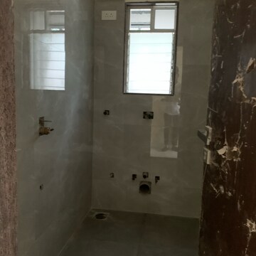 Bathroom in 2 BHK Apartment at Kosmos Kedar Darshan, Kastur Park – for Sale