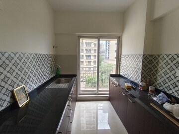 Kitchen in 1 BHK Apartment at Shree Tirupati STG Signature Residency, Patlipada – for Rent