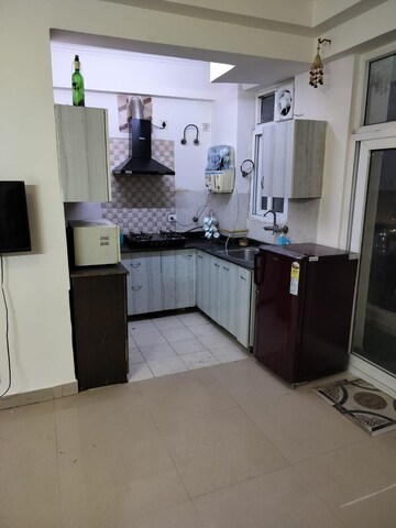 Kitchen in 2 BHK Apartment at Amrapali Princely Estate, Sector 76 – for Rent