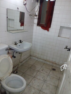 Bathroom in 2 BHK Apartment at RWA Jasola Sector 8 SFS Flat, Jasola – for Sale