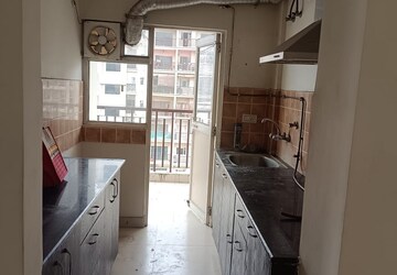 Kitchen in 2 BHK Apartment at Aims Golf Avenue II, Sector 75 – for Rent