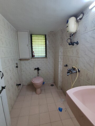 Bathroom in 2 BHK Apartment at Mandar Apartments, Andheri West – for Rent