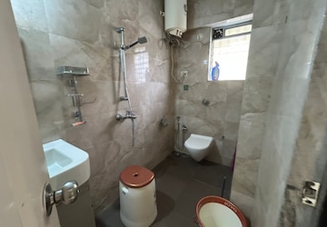 Bathroom in 1 BHK Apartment at Raunak Unnathi Woods Phase 4 And 5, Ghodbunder Road – for Sale