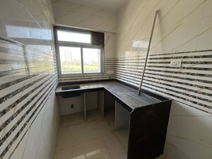 Kitchen in 1 BHK Apartment at Raunak Unnathi Woods Phase 7 A And B, Ghodbunder Road – for Sale