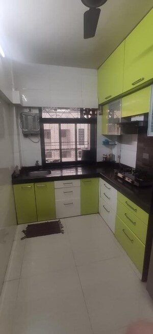 Kitchen in 2 BHK Apartment at Dheeraj Uphar CHS. LTD., Malad East – for Rent