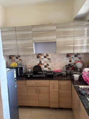 Kitchen in 2 BHK Apartment at Gaur City 6th Avenue, Sector 4 Greater Noida – for Rent
