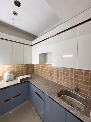 Kitchen in 2 BHK Apartment at Mahagun Mywoods, Sector 16c Greater Noida – for Rent