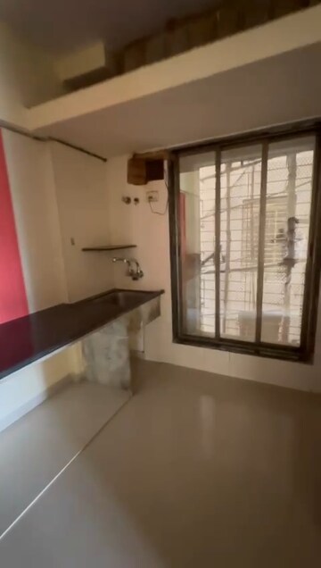 Kitchen in 2 BHK Apartment at Swarna Apartments, Mira Road – for Sale