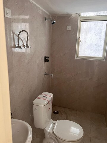 Bathroom in 4 BHK Builder Floor at Puri Aman Vilas, Sector 89 – for Sale