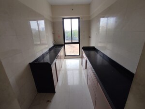 Kitchen in 2 BHK Apartment at Vistas CHS, Kavesar – for Rent