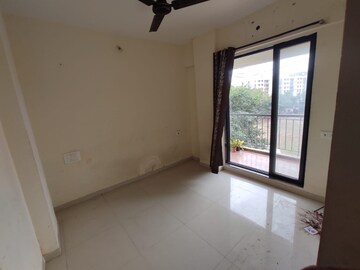 Room in 2 BHK Apartment at Vistas CHS, Kavesar – for Rent