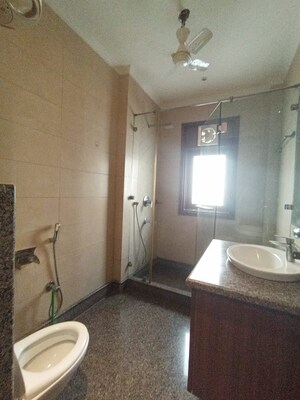 Bathroom in 3 BHK Builder Floor at Pamposh Enclave – for Rent