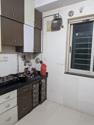 Kitchen in 2 BHK Apartment at Sheth Vasant Lawns, Laxmi Nagar – for Rent