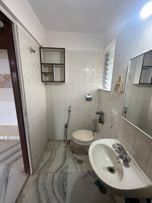 Bathroom in 3 BHK Apartment at Express Apartment, Yari Road – for Rent
