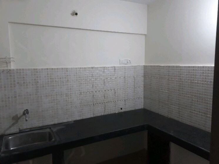Kitchen, jalan-aura-county-pune 1 Bedroom 550 Sq.Ft. Apartment In Wagholi Pune 9375785