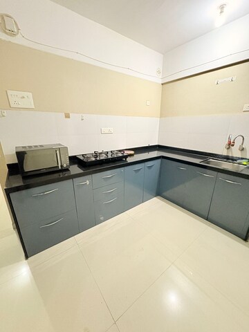 Kitchen in 2 BHK Apartment at Kohinoor Courtyard One, Wakad – for Rent