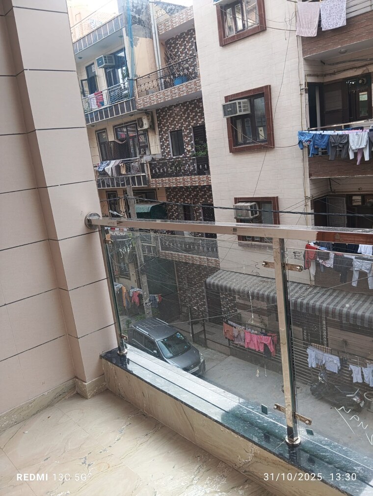 Balcony, rohini sector 25 3 Bedroom 900 Sq.Ft. Builder Floor In Rohini Sector 25 Delhi 9376662
