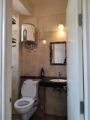 Bathroom in 2 BHK Apartment at Wave Executive Floors, Wave City – for Rent