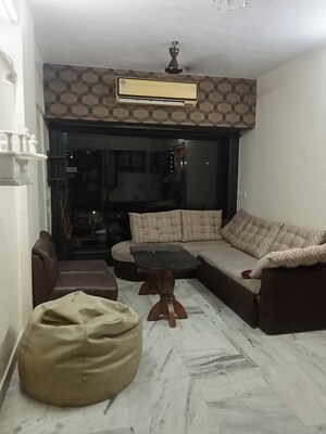 Living Room in 1 BHK Apartment at Riddhi Garden, Malad East – for Rent