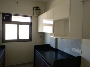 Kitchen in 2 BHK Apartment at Lashkaria Anurag CHS, Andheri West – for Rent