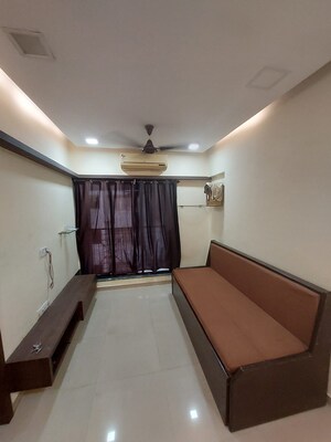 Living Room in 1 RK Apartment at Metro Triple S Heights, Malad West – for Sale