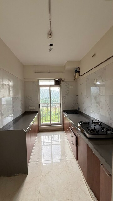 Kitchen in 2 BHK Apartment at Vihang Vermont, Ghodbunder Road – for Rent