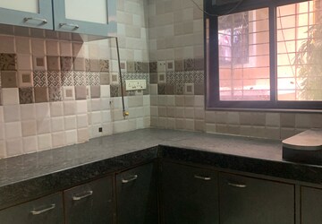 Kitchen in 2 BHK Apartment at Unique Abode, Kastur Park – for Rent